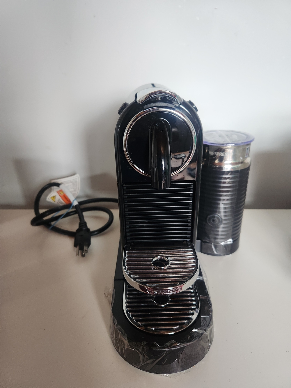 Nespresso Black and Chrome Compact Espresso Machine with Milk Frother
